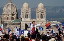 French President and centrist candidate Emmanuel Macron waves during a campaign rally, Saturday, April 16, 2022 in Marseille, southern France.