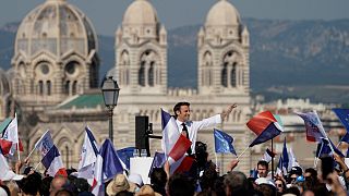 French President and centrist candidate Emmanuel Macron waves during a campaign rally, Saturday, April 16, 2022 in Marseille, southern France.