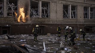 Firefighters work to extinguish multiple fires after a Russian attack in Kharkiv, Ukraine, Saturday, April 16, 2022.