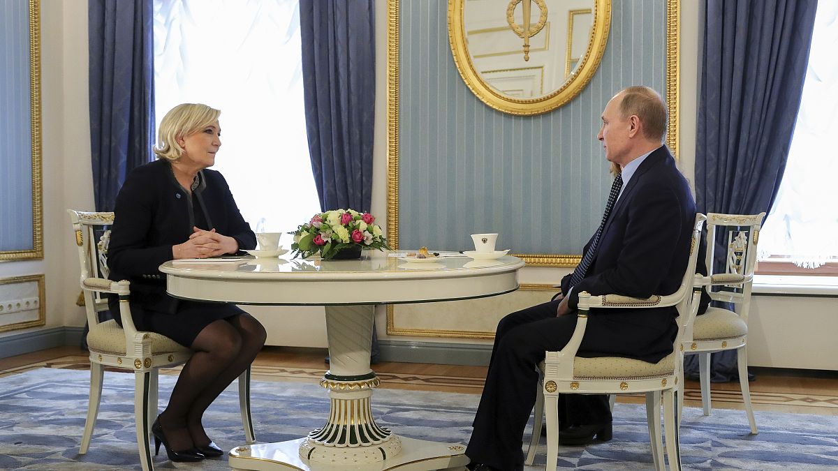 Russian President Vladimir Putin, right, speaks to French far-right presidential candidate Marine Le Pen, in the Kremlin in Moscow, Russia, Friday, March 24, 2017. 