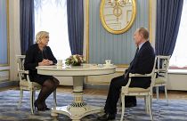 Russian President Vladimir Putin, right, speaks to French far-right presidential candidate Marine Le Pen, in the Kremlin in Moscow, Russia, Friday, March 24, 2017.