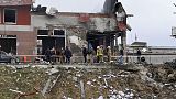 Emergency workers clear up debris after an airstrike hit a tire shop in the western city of Lviv, Ukraine, Monday April 18, 2022. 