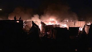 Firefighters and residents battle fire in Cape Town shack dwellings