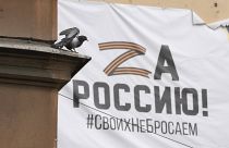 A banner with the letter Z hangs on a building in St. Petersburg.