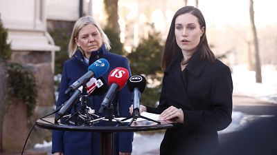 Finnish Prime Minister Sanna Marin, right, and her Swedish counterpart Magdalena Andersson speak to the media outside the Prime Minister's official residence Kesaranta
