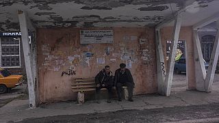 People wait at a bus station in Kramatorsk, Ukraine, Friday, April 15, 2022.