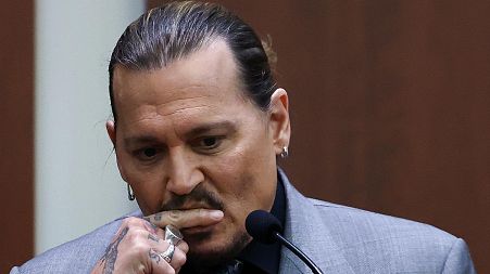 Actor Johnny Depp testifies during a hearing in the courtroom at the Fairfax County Circuit Court in Fairfax, Va., Wednesday, April 20, 2022.
