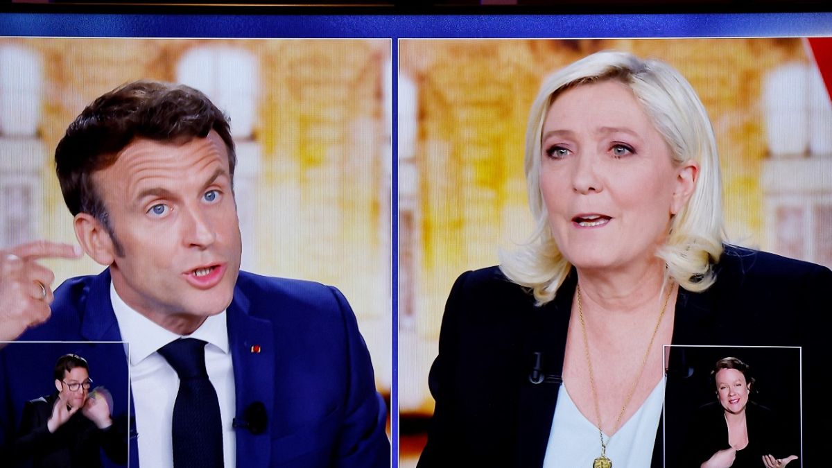 Emmanuel Macron and Marine Le Pen challenge each other during their TV debate on French TV channels TF1 and France 2, in Saint-Denis, near Paris, April 20, 2022.