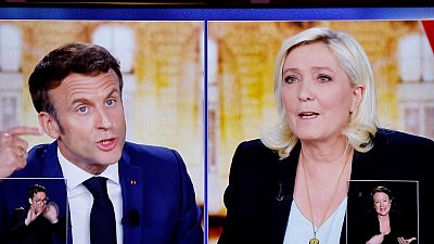 Emmanuel Macron and Marine Le Pen challenge each other during their TV debate on French TV channels TF1 and France 2, in Saint-Denis, near Paris, April 20, 2022.