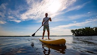 Paddleboarding to work.