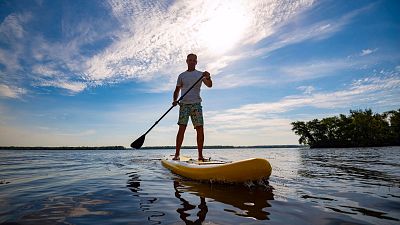 Paddleboarding to work. Paddleboarding to work.