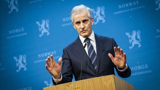 Norway's Prime Minister Jonas Gahr Store gestures during a press conference in Oslo.