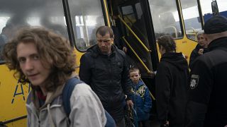 Internally displaced people from Mariupol arrive at a refugee center fleeing from the Russian attacks, in Zaporizhzhia, Ukraine, Thursday, April 21, 2022.