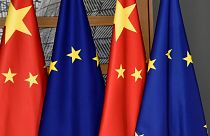 EU and Chinese flags are seen at the Europa building in Brussels, Dec. 17, 2019.