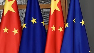 EU and Chinese flags are seen at the Europa building in Brussels, Dec. 17, 2019. 