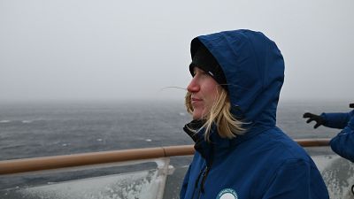 Global Choices' Emma Wilkinson looks out from a ship on the Antarctic expedition. Global Choices' Emma Wilkinson looks out from a ship on the Antarctic expedition.