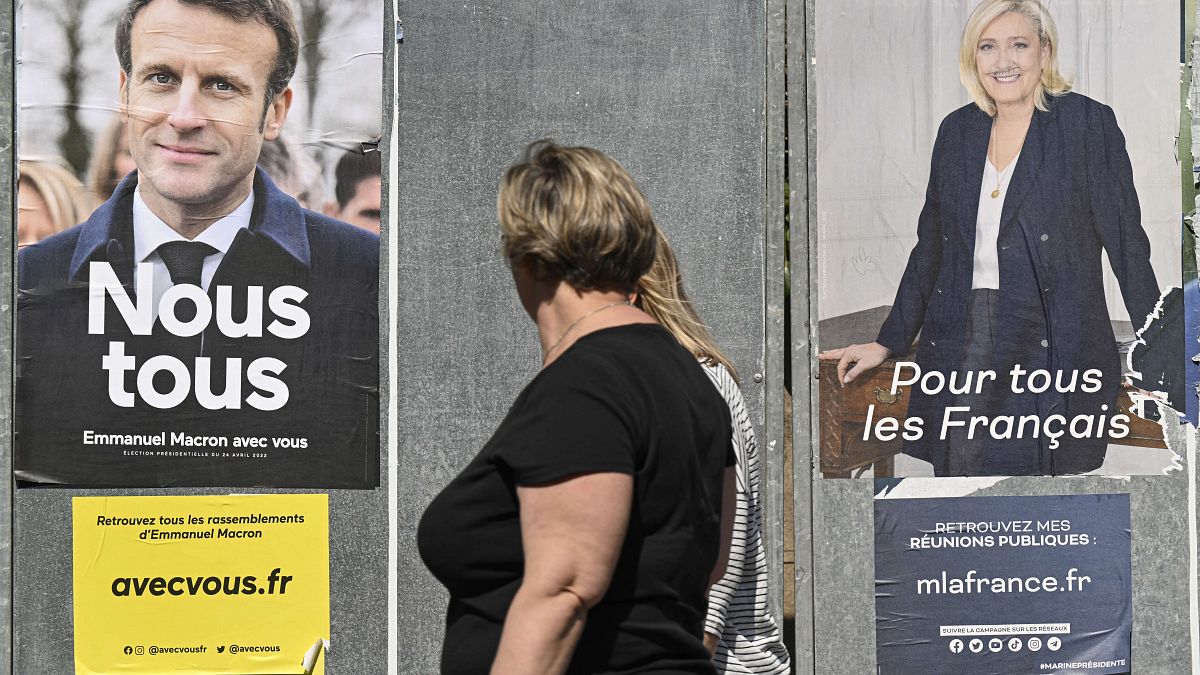 Campaign posters for French presidential candidates Emmanuel Macron and Marine Le Pen in Eguisheim, eastern France, on April 21, 2022