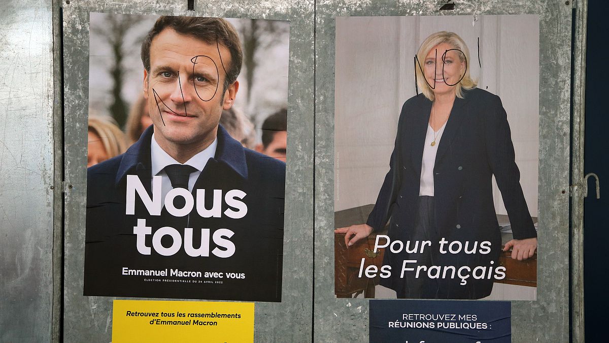 Advertisements featuring both candidates in the French presidential runoff, Emmanuel Macron and Marine Le Pen.