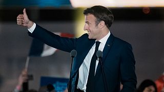 French President Emmanuel Macron celebrates with supporters in Paris.