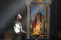 A Ukrainian soldier prays in St. Michael Cathedral during Easter celebration in Kyiv, Ukraine, Sunday, April 24, 2022.