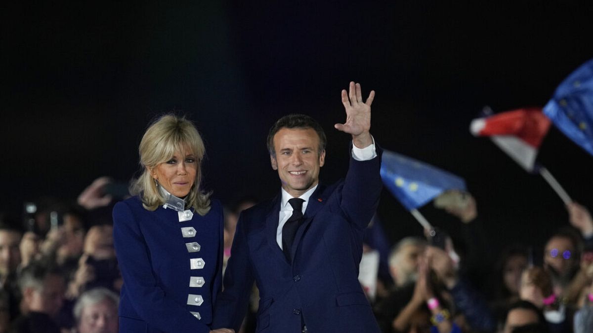 French President Emmanuel Macron celebrates with supporters in front of the Eiffel Tower Paris, France, Sunday, April 24, 2022. 