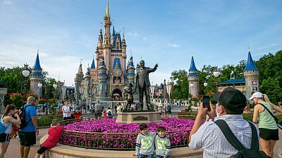 People visit Magic Kingdom Park at Walt Disney World Resort in Florida last week.