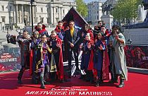 Actor Benedict Cumberbatch poses for a photocall with cosplayers in London ahead of the release of 'Doctor Strange in the Multiverse of Madness'