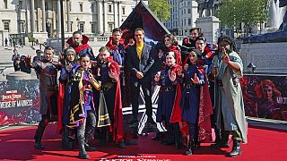 Actor Benedict Cumberbatch poses for a photocall with cosplayers in London ahead of the release of 'Doctor Strange in the Multiverse of Madness'