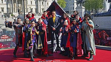 Actor Benedict Cumberbatch poses for a photocall with cosplayers in London ahead of the release of 'Doctor Strange in the Multiverse of Madness'