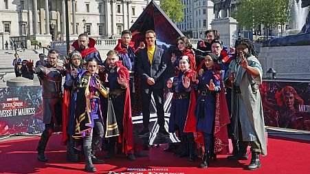 Actor Benedict Cumberbatch poses for a photocall with cosplayers in London ahead of the release of 'Doctor Strange in the Multiverse of Madness'