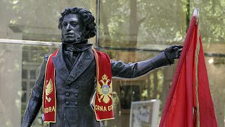 Russian 19th century author Alexander Sergeevich Pushkin's monument is draped with Montenegrin flags in Podgorica in 2006