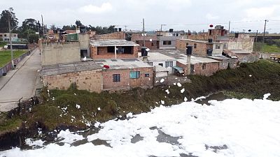 Polluted river foam floats into Colombia town