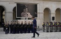 French President Emmanuel Macron walks during a national homage to late French actor Michel Bouquet