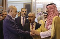 Turkish President Recep Tayyip Erdogan, left, and Saudi Arabia's Crown Prince Mohammed bin Salman speak after their meeting in Jiddah, Saudi Arabia, Friday, April 29, 2022.
