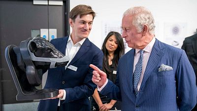 Prince Charles views a design at the Royal College of Art for the school's Terra Carta Design Lab Exhibition.