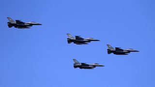 Greek fighter jets fly over the military parade on Independence Day in Athens.