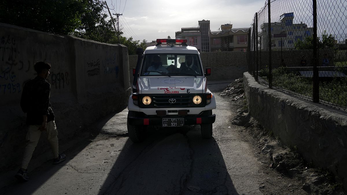 An ambulance carrying wounded people leaves the site of an explosion in Kabul.