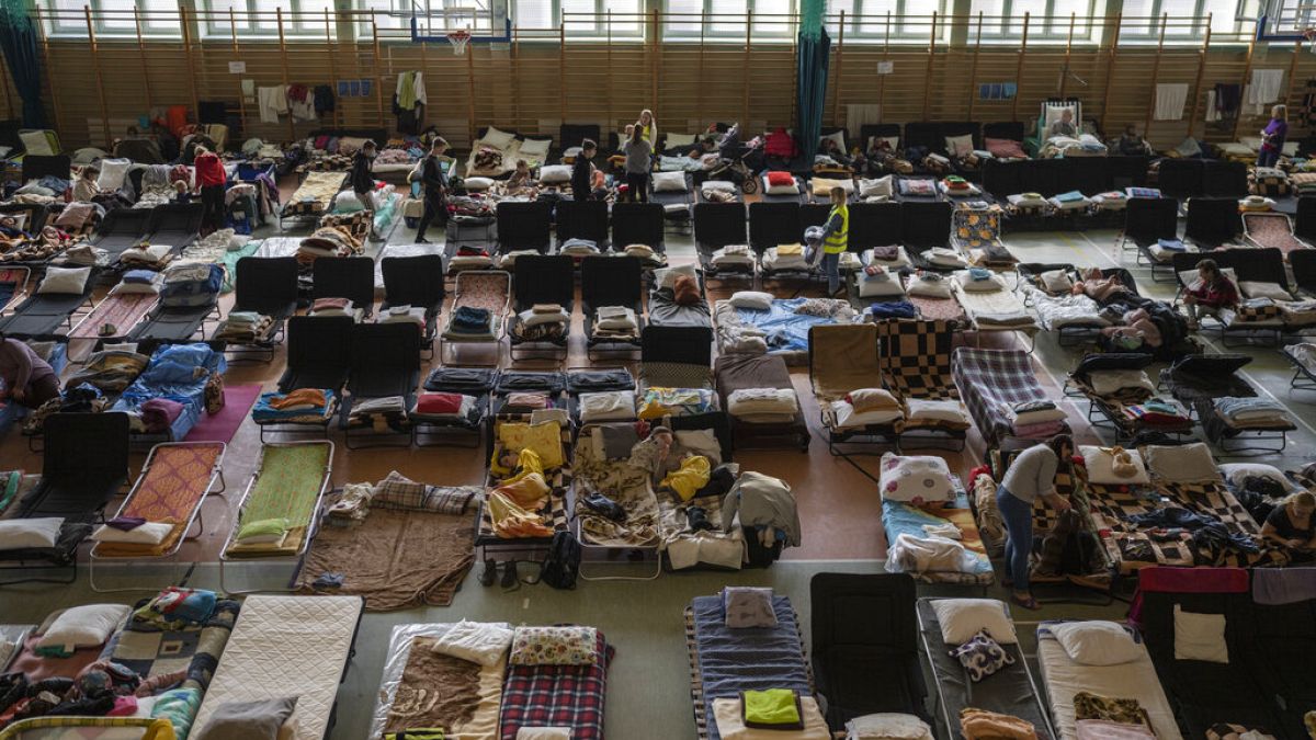 People who fled the war in Ukraine inside an indoor sports stadium used as a refugee centre, at Medyka, a border crossing between Poland and Ukraine, March 15, 2022.