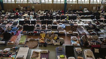 People who fled the war in Ukraine inside an indoor sports stadium used as a refugee centre, at Medyka, a border crossing between Poland and Ukraine, March 15, 2022.