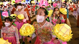 Participants march during a lantern parade to celebrate the upcoming Buddha's birthday, in Seoul.