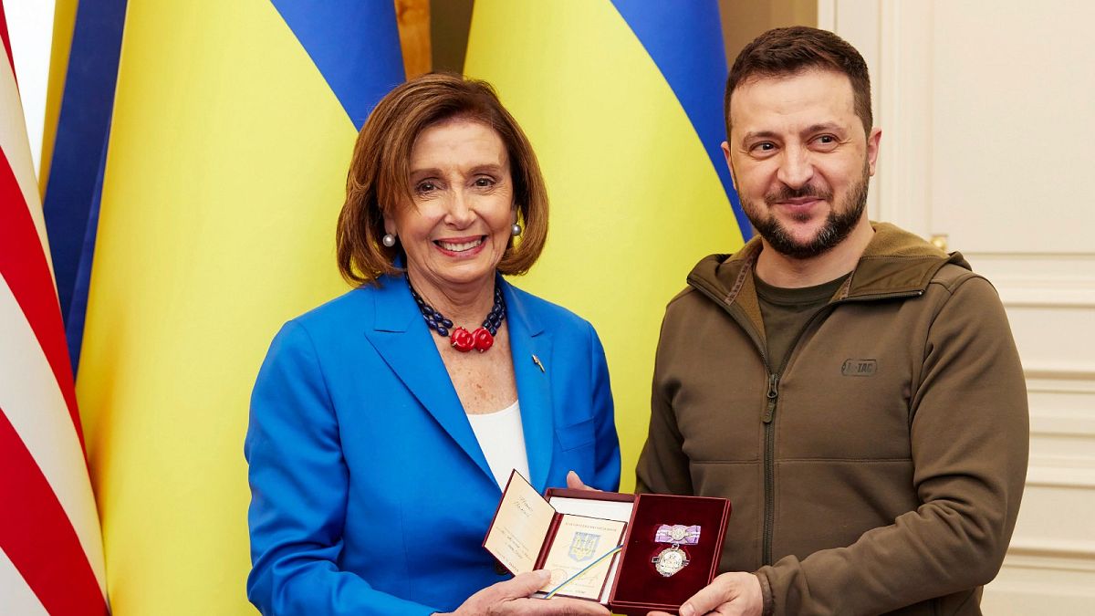 Ukrainian President Volodymyr Zelenskyy, right, awards the Order of Princess Olga, the third grade, to US Speaker of the House Nancy Pelosi in Kyiv.