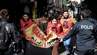 Turkish riot police officers arrest demonstrators during a May Day rally marking the international day of the worker near Taksim square, a district of Istanbul.