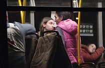 Civil evacuees sit in a bus in an area controlled by Russian-backed separatist forces in Bezimenne