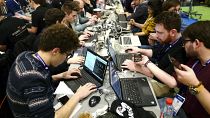 Cyber Security experts take part in a test at the Cybersecurity Conference in Lille, northern France, Tuesday Jan. 22, 2019. 