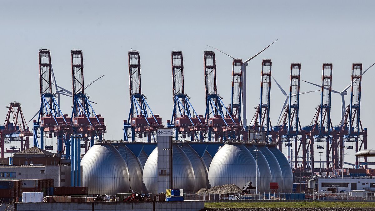 Tanks for producing bio gas are pictured at the harbor in Hamburg in April 2022
