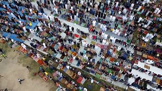 Crowds take part in Eid al-Fitr morning prayers