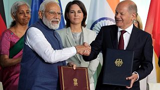 German Chancellor Olaf Scholz (R) and Indian Prime Minister Narendra Modi (L) after a contract signing ceremony at the chancellery in Berlin, May 2, 2022.