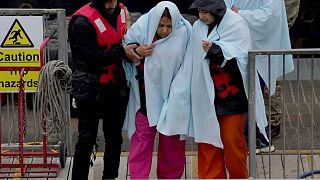 A group of people thought to be migrants are brought in to Dover, Kent, following a small boat incident in the English Channel, Monday May 2, 2022.