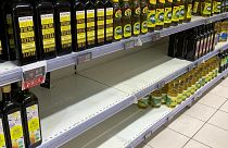 A picture taken on April 5, 2022, shows empty shelves where sunflower oil is usually found at a supermarket in Paris. 