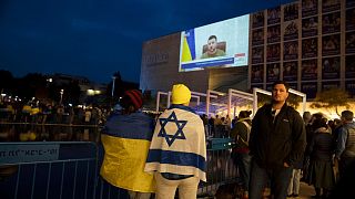 People gather in Tel Aviv to watch an address by Ukrainian President Volodymyr Zelenskyy in March.